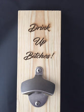 Load image into Gallery viewer, Hanging bottle opener. &quot;Drink Up Bitches&quot; custom opener.
